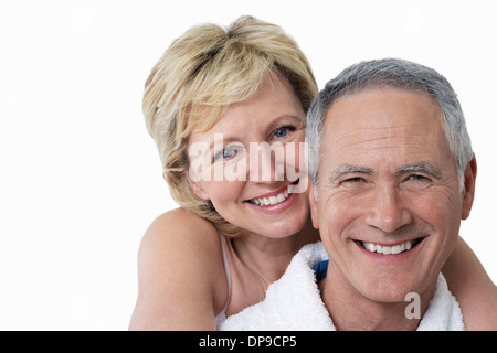 Portrait of loving couple smiling over white background Stock Photo