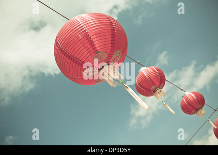 Red Chinese Paper Lanterns against a Blue Sky. Horizontal filtered shot Stock Photo
