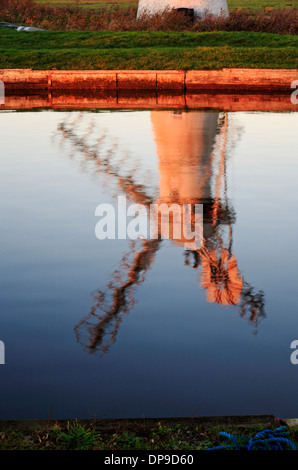 A reflection of Thurne Dyke Drainage Mill on the Norfolk Broads at Thurne, Norfolk, England, United Kingdom. Stock Photo