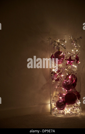 Christmas Lights and Ornaments in a Glass tube. Stock Photo