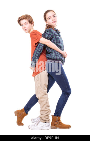 brother and sister back on back, isolated on white. Stock Photo