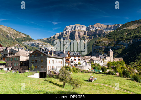 Village of Torla in front of the Pena Blanca and Punta Narronal mountains at the entrance to the Orsesa valley national park Stock Photo