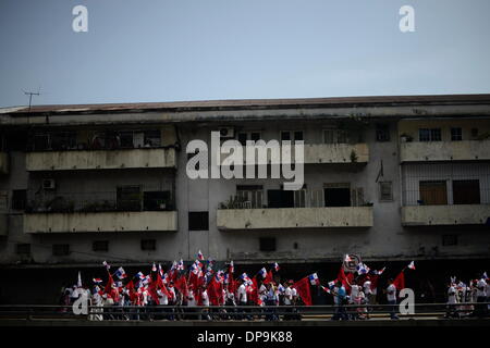 Panama City, Panama. 09th Jan, 2014. Residents march during the commemoration of the Martyrs' Day, in Panama City, capital of Panama, on Jan. 9, 2014. The Martyrs' Day was a movement occurred in Panama on Jan. 9, 1964, when troops of the U.S. Army clashed with high school students who demanded the right to raise the national flag in the area known as Canal Zone, a strip of land around the Panama Canal, which was ceded to the United States of America in perpetuity as a result of the Hay-Bunau-Varilla Treaty. Credit:  Mauricio Valenzuela/Xinhua/Alamy Live News Stock Photo