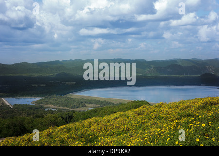 water reservoir in valley with flower at foreground,lampang thailand. Stock Photo