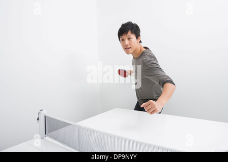 Portrait of man playing table tennis Stock Photo