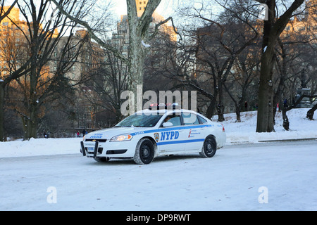 A NYC police car on a snow covered roadway Stock Photo