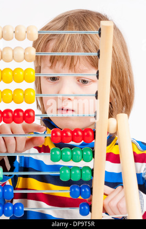 Boy Counting on Colorful Wooden Abacus - Isolated on White Stock Photo