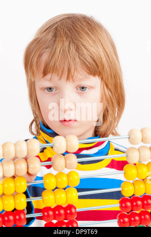 Boy Counting on Colorful Wooden Abacus - Isolated on White Stock Photo