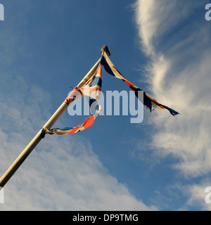 tattered British Union Jack Flag torn by the wind Stock Photo