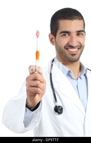Arab doctor man showing a toothbrush isolated on a white background Stock Photo