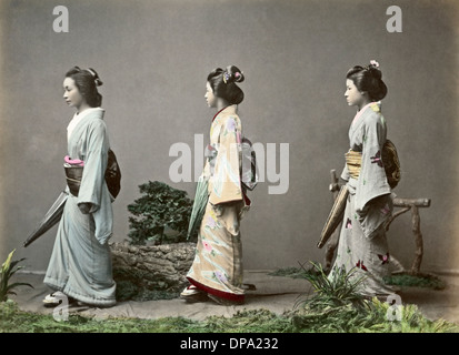Geishas with parasols and obi sashes, Japan Stock Photo