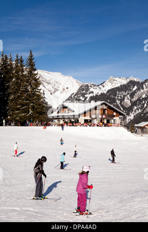 Skiing in Les Portes du Soleil at the Cret Beni cafe on the piste, La Chapelle D'Abondance, Haut Savoie, French Alps, France Stock Photo