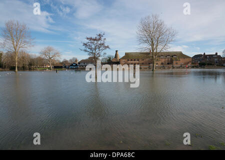 St Neots, Cambridgeshire, UK. 10th January 2014. The River Great Ouse overflows its banks and submerges the riverside park at the market town of St Neots Cambridgeshire UK 10th January 2014. The river flows from central England through East Anglia to the wash and the water levels are still high after the recent wet weather across the country. Credit Julian Eales/Alamy Live News Stock Photo