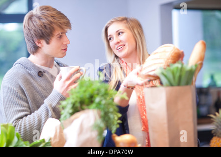 Young woman unpacking shopping Stock Photo