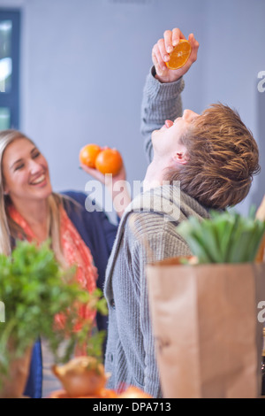 Young couple messing around in kitchen Stock Photo
