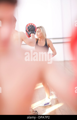Young adults training in gym Stock Photo