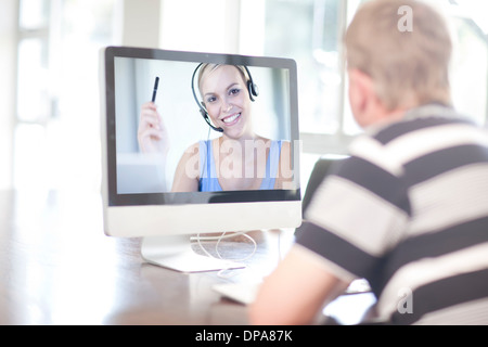 Man using computer for video call Stock Photo