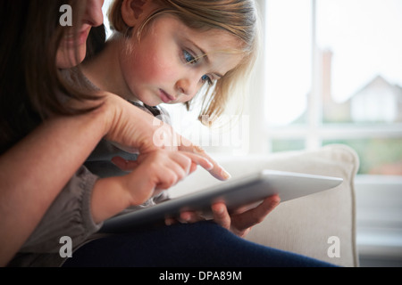 Mother and daughter using digital tablet Stock Photo