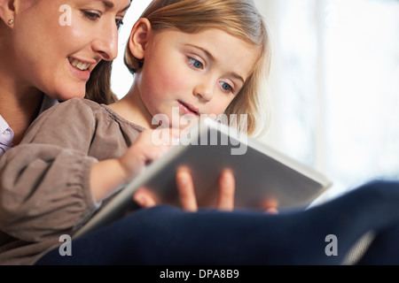 Mother and daughter using digital tablet Stock Photo