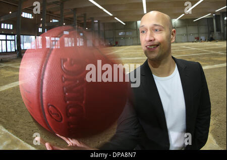 Hamburg, Germany. 08th Jan, 2014. The former German Basketball national player Pascal Roller juggles with a basketball in Hamburg, Germany, 08 January 2014. In october Roller wants to participate at the basketball Bundesliga with the team Hamburg Towers. Photo: Axel Heimken/dpa/Alamy Live News Stock Photo