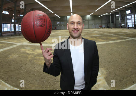 Hamburg, Germany. 08th Jan, 2014. The former German Basketball national player Pascal Roller juggles with a basketball in Hamburg, Germany, 08 January 2014. In october Roller wants to participate at the basketball Bundesliga with the team Hamburg Towers. Photo: Axel Heimken/dpa/Alamy Live News Stock Photo