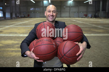 Hamburg, Germany. 08th Jan, 2014. The former German Basketball national player Pascal Roller holds a couple of basketballs in his hands in Hamburg, Germany, 08 January 2014. In october Roller wants to participate at the basketball Bundesliga with the team Hamburg Towers. Photo: Axel Heimken/dpa/Alamy Live News Stock Photo