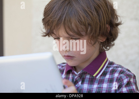 Boy using digital tablet Stock Photo