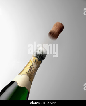 Popping Champagne bottle Stock Photo