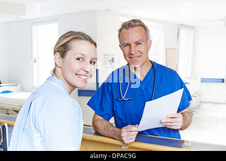 Doctor and nurse looking at camera Stock Photo