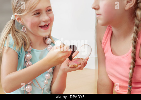 Sisters playing with make up Stock Photo