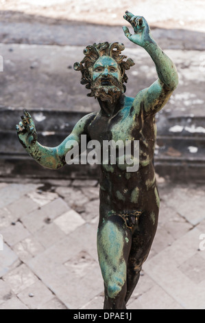 the Fauno bronze statue inside the pompeii ruins, italy Stock Photo