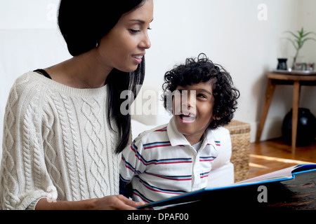 Mother and son looking at book Stock Photo