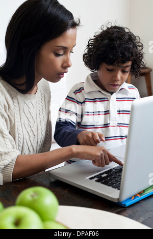 Mother and son using laptop Stock Photo
