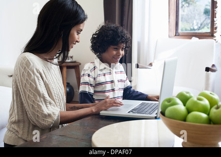 Mother and son using laptop Stock Photo
