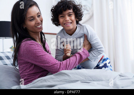 Mother and son in bed Stock Photo - Alamy