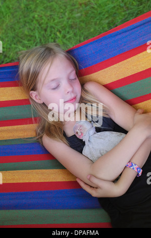 Young girl resting in hammock Stock Photo