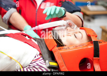 Paramedic monitoring patient in hospital Stock Photo