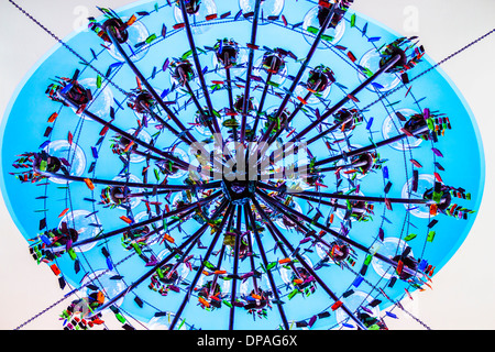 View of a skylight looking up through a giant chandelier Stock Photo