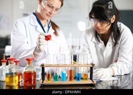 Two chemistry students doing experiment Stock Photo
