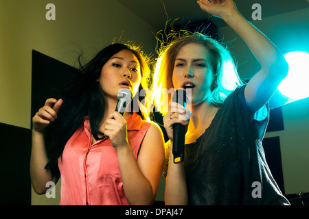 Women dancing and singing Stock Photo