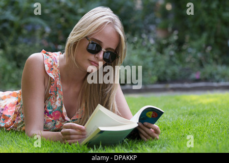 Young woman reading book Stock Photo