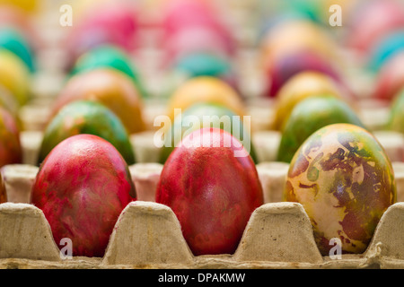 Easter eggs in various colors placed in row. Stock Photo