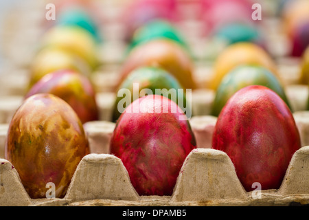 Easter eggs in various colors placed in row. Stock Photo