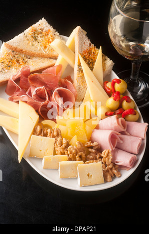tasty and generous cheese platter to share Stock Photo