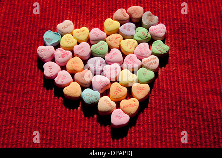 Conversation hearts in a large heart shape Stock Photo