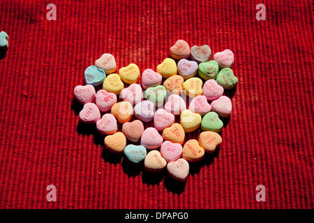 Conversation hearts in a large heart shape Stock Photo