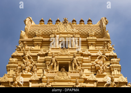 Plenty of golden statues on the top of the entrance tower at Sri Naheshwara in Bengaluru. Stock Photo