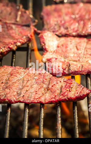 Closeup of steak on grill fire-toasted Stock Photo