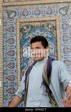 Afghan man in front of 20th century tile work, Friday Mosque, Herat, Afghanistan Stock Photo