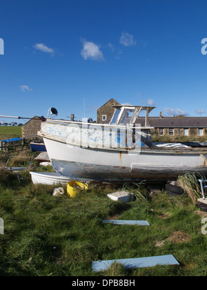 Fishing boat stored at Boulmer, Northumberland, England. Stock Photo